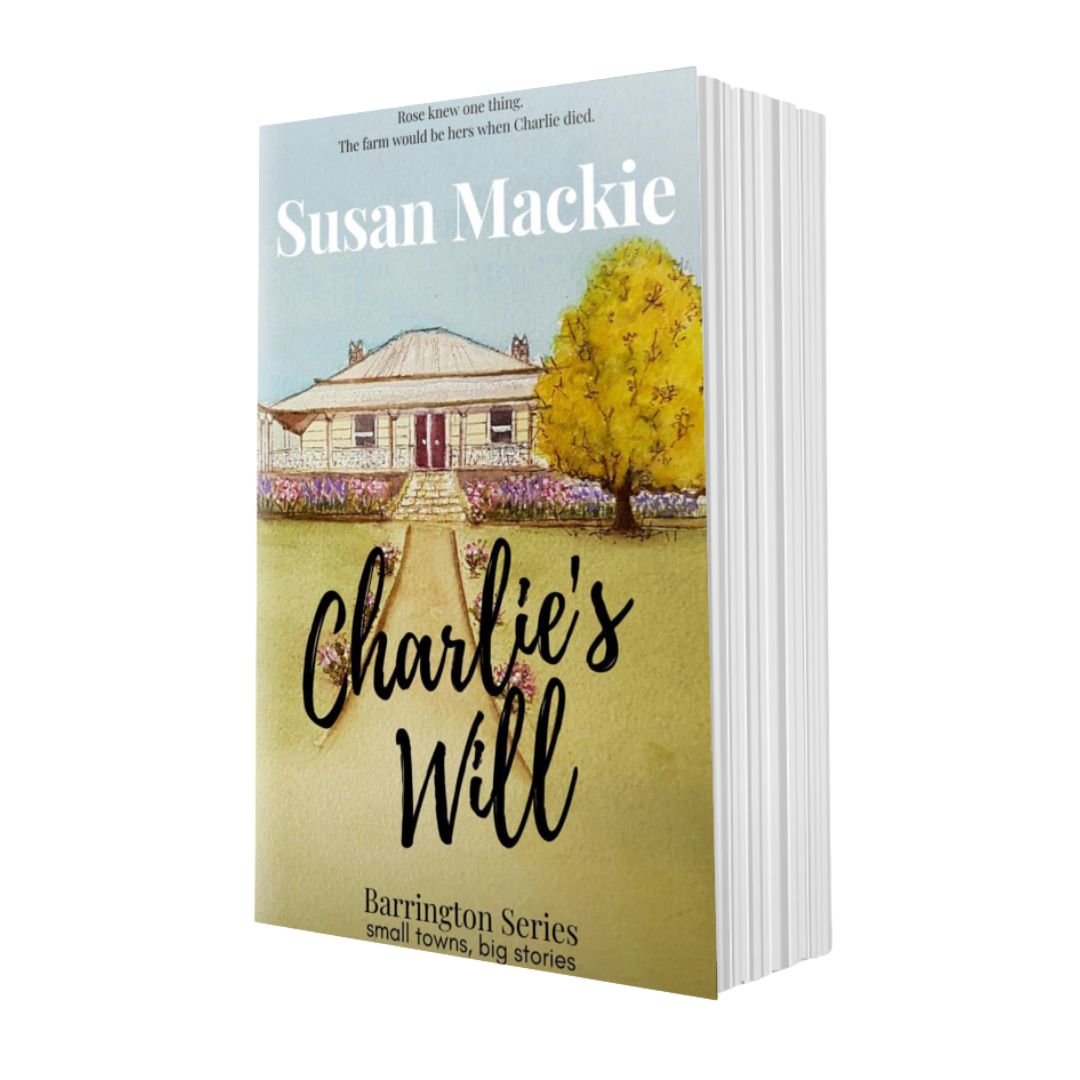 Book titled 'Charlie's Will' by Susan Mackie with a wtercolour painting of a homestead.