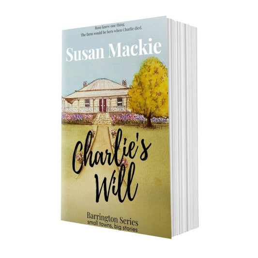 Book titled 'Charlie's Will' by Susan Mackie with a wtercolour painting of a homestead.